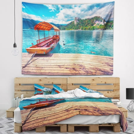 DESIGN ART Designart 'Boat in Lake Bled In Julian Alps' Landscape Wall Tapestry