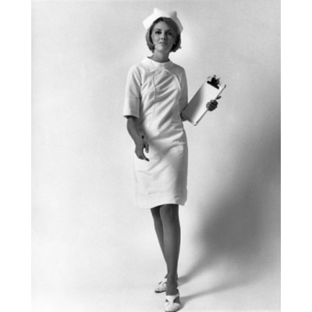 Portrait of a female nurse walking and holding a clipboard Poster Print