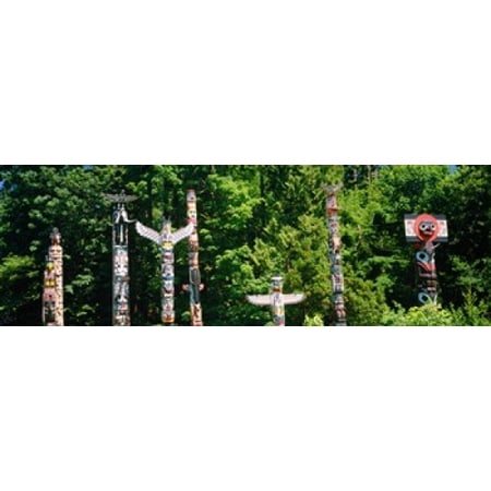 Totem poles in a a park Stanley Park Vancouver British Columbia Canada Stretched Canvas - Panoramic Images (36 x 12)
