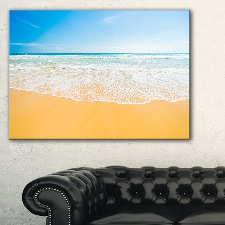DESIGN ART Long Waves on Sand under Blue Sky - Seashore Canvas Wall Artwork