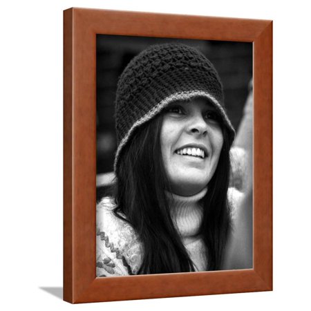 Ali MacGraw smiling and wearing a Bonnet Framed Print Wall Art By Movie Star News