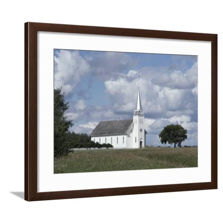 White Church Against a Cloudy Sky Framed Print Wall Art