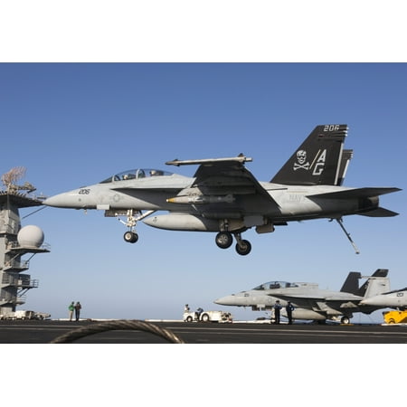 October 4 2012 - An FA-18F Super Hornet of VFA-103 Jolly Rogers during flight operations on the USS Dwight D Eisenhower in the Arabian Sea in support of Operation Enduring Freedom Poster Print