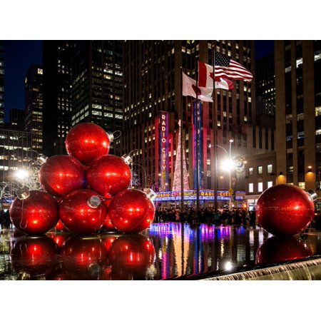 The Giant Christmas Ornaments on Sixth Avenue across from the Radio City Music Hall by Night Print Wall Art By Philippe Hugonnard