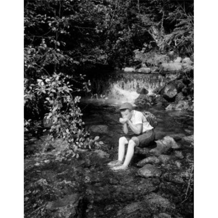 Posterazzi SAL255424555 Boy Sitting & Drinking Water From Mountain Stream Poster Print - 18 x 24 in.