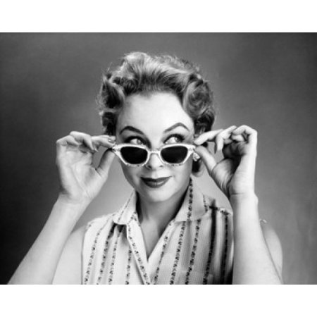 Posterazzi Close-up of a young woman holding sunglasses Canvas Art - (24 x 36)