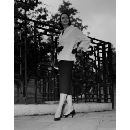 Young woman posing in elegant dress Poster Print