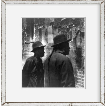 Photograph of Chinese in Chinatown San Francisco: 2 Chinese men reading handbil