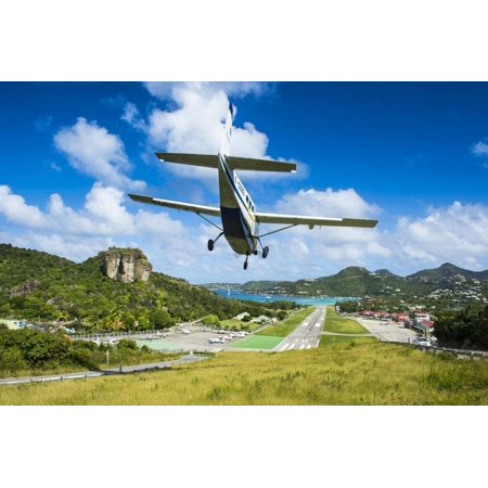 Small airplane landing at the airport of St. Barth (Saint Barthelemy), Lesser Antilles, West Indies Print Wall Art By Michael Runkel