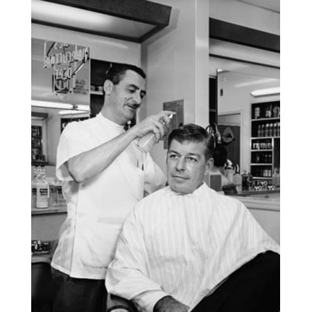 Barber spraying hair of a mid adult man in a salon Canvas Art - (18 x 24)