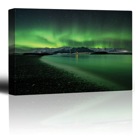 wall26 - Green Northern Lights Above Snowed in Mountains and Being Reflected on a Lake - Canvas Art Home Decor - 24x36 inches