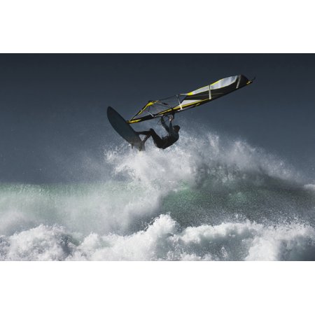Windsurfer in the air above splashing waves Tarifa Cadiz Andalusia Spain Poster Print by Ben Welsh Design Pics