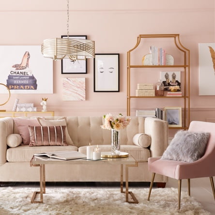 A beautiful glam style living room with pink velvet sofa, golden shelving, pink velvet accent chair and a glass coffee table. Showcases how fresh and clean your new years home can be.