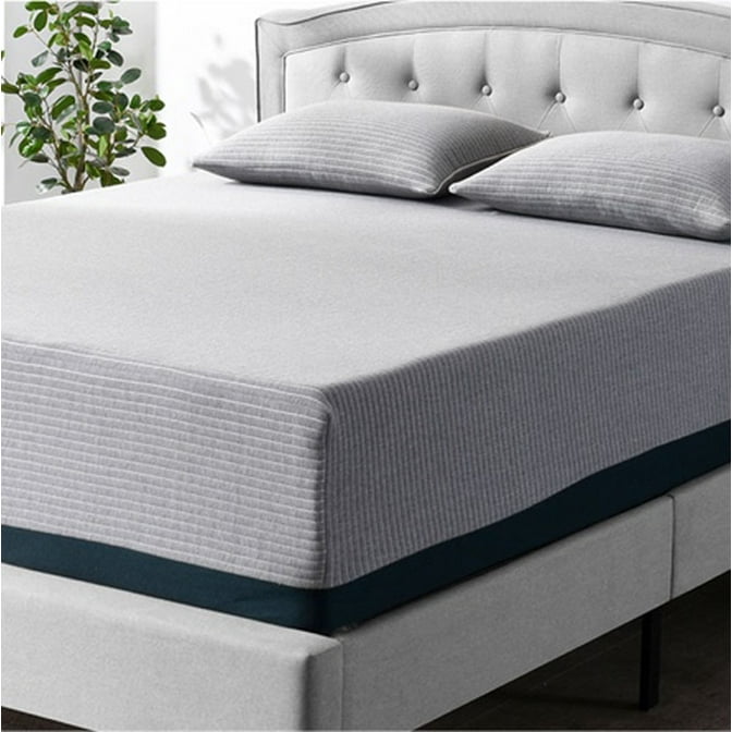 A close-up shot of a Better Homes and Gardens mattress in gray on a platform bed frame with a tufted headboard