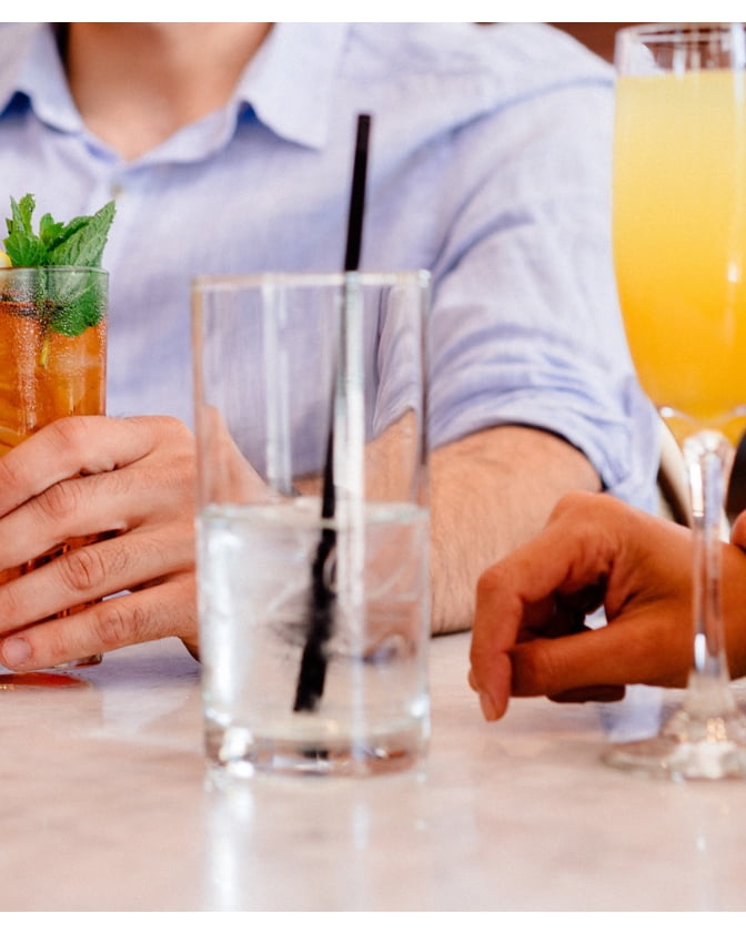 Guests sitting with drinks in hand at spring brunch.