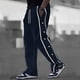 thumbnail image 1 of Pantalones largos para hombre, de poliéster, holgados, informales, a la moda, con botones, bolsillos, cordón y cintura elástica., 1 of 6