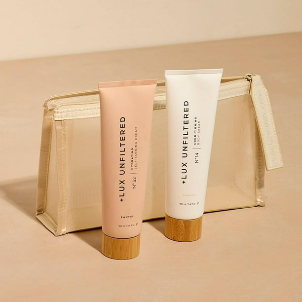 + Kit de viaje Lux sin filtro de primera clase Glow Incluye crema autobronceadora hidratante N32 en Santal Crema corporal acondicionadora N14 en Santal y una bolsa de cosméticos resistente al agua Fác