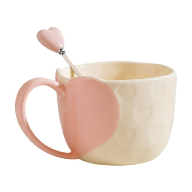 taza de café taza de té reutilizable drinkware linda decoración creativa del hogar taza de café taza de agua para adultos cocina hogar comedor niñas rosa Taza de cerámica rosa y crema con relieve de corazones y asa en forma de corazón, vista frontal 3/4 que muestra el esmalte brillante, capacidad 350 ml y la cucharita con remate en corazón; a menudo se usa también para servir chocolate caliente o como recipiente decorativo en la cocina.