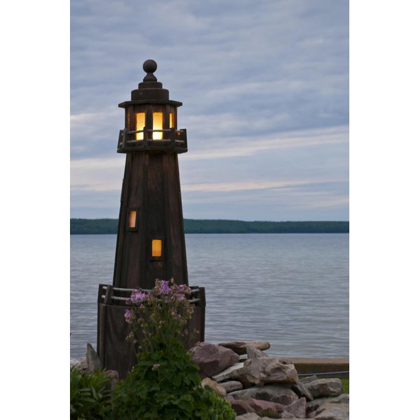 USA, Michigan. Yard decoration lighthouse on Munising Bay ...