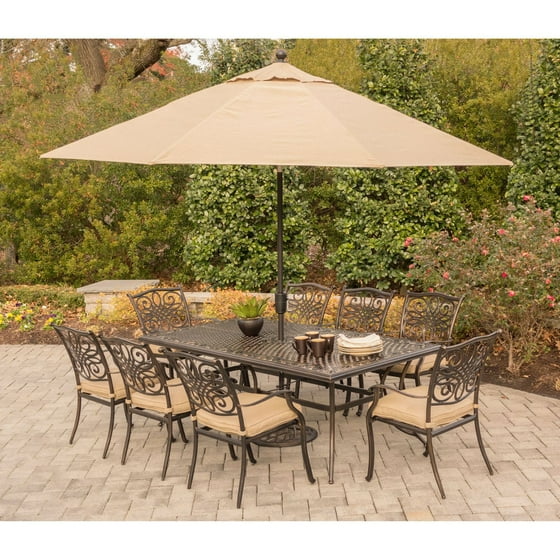 Hanover Outdoor Traditions 9 Piece Dining Set With 42 X 84 Cast Top Table 8 Stationary Chairs And Umbrella W Stand In Natural Oat