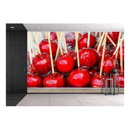 wall26 - Sweet Glazed Red Toffee Candy Apples on Sticks for Sale on Farmer Market or Country Fair. - Removable Wall Mural | Self-Adhesive Large Wallpaper - 66x96
