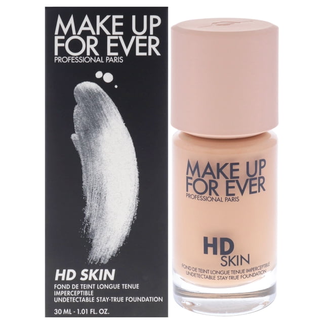 base de maquillaje hd skin indetectable stay-true - 2y30 warm sand de make up for ever para mujeres - base de 1,01 oz Frasco de vidrio frontal con tapa beige junto a su caja negra, muestra el tono arena tibia y la marca MAKE UP FOR EVER; base líquida de cobertura media a completa de 24 horas con acabado mate natural. A menudo usada también para pruebas de color en kits de maquillaje profesional.