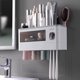 thumbnail image 2 of Soporte para cepillo de dientes, artículo multifunción para el hogar, exprimidor automático de pasta de dientes, estantes de almacenamiento, accesorios de baño, (tres tazas-gris) JM, 2 of 5