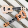 thumbnail image 4 of Mini Ukulele Toy, Children's Musical Instrument, Interactive Lightweight Ukulele for Toddlers and Kids, Durable ABS Plastic with Nylon Strings, Easy to Carry Educational Gift, 4 of 5