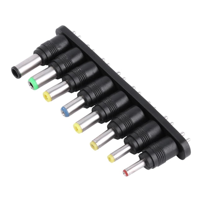 juego 8 en 1 de adaptador de corriente ac universal dc juego de ocho puntas intercambiables para cargador de portátil con conectores en un soporte negro, vista en 3/4 de las puntas metálicas alineadas, casquillos multicolor que identifican tamaños y diseño compacto, incluye adaptador principal.