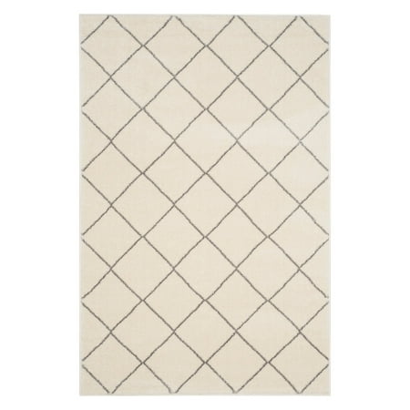 - Safavieh Tunisia Joyce Geometric Area Rug or Runner