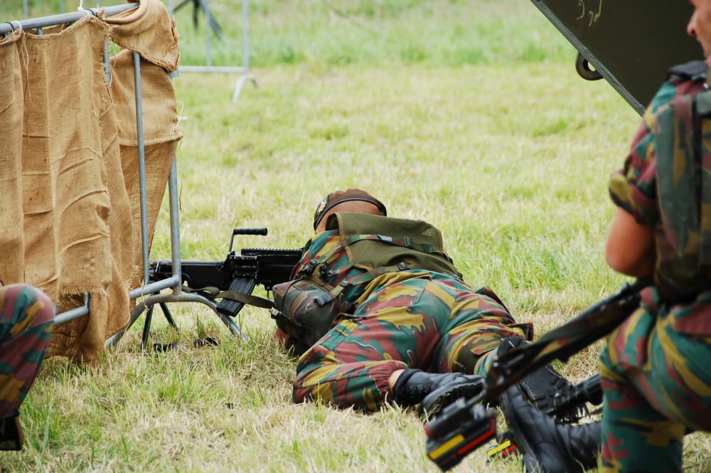 A soldier of the Belgian Army on guard with his FN Minimi rifle Canvas Art - Luc De JaegerStocktrek Images (34 x 23)