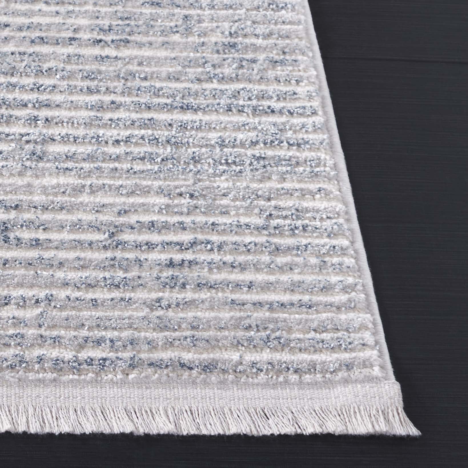 SAFAVIEH Whisper Zoe Solid Area Rug, Blue/Grey, 5'3" x 7'6"