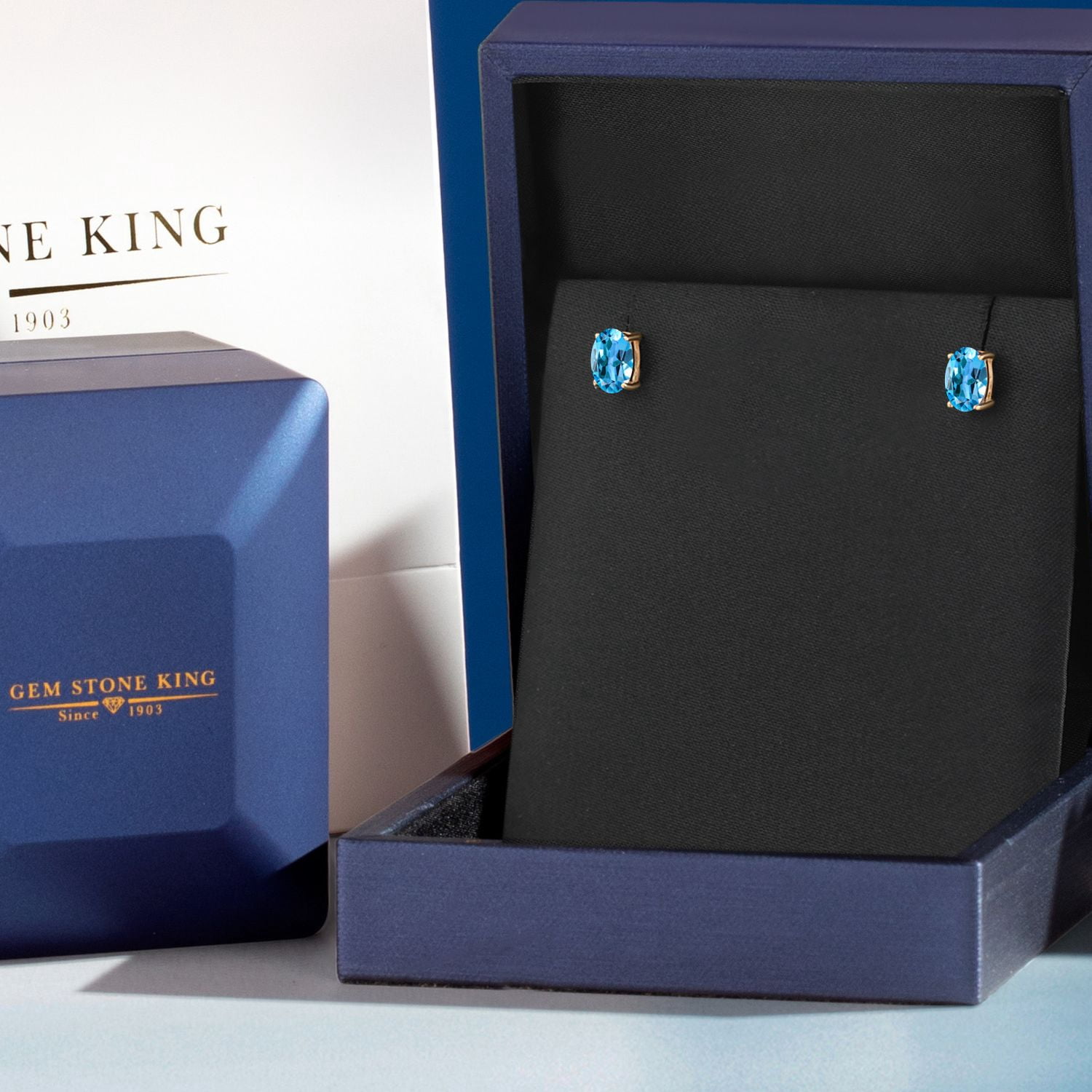 Gem Stone King 10K Yellow Gold Swiss Blue Topaz Stud Earrings for Women Men (1.10 Cttw, Gemstone November Birthstone, Oval 6X4MM)
