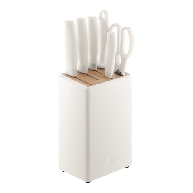 ZWILLING Now Pro 7 Piece Knife Block Set in white, featuring a 3-inch vegetable knife, 6-inch meat cleaver, 7-inch vegetable cleaver, 7-inch santoku, sharpening steel, shears, and a 6-slot knife block. Made with Zwilling special formula stainless steel and FRIODUR ice-hardened for durability and long-lasting sharpness. The precision-stamped construction ensures a lightweight design. The set is displayed in a sleek white block with a natural wood top, suitable for modern kitchens.