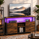 thumbnail image 1 of Zocalo Mueble para TV con 4 Cajones y Luces LED, Centro de Entretenimiento con 2 Enchufes y 2 Puertos USB, Estantes de Almacenamiento, Estilo Rústico Industrial, Marrón, 1 of 10
