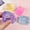Purple, variant on 4-Pack Aurora Glitter Ice Cube Squishing Toys - Soft Maltose Stress Balls for Anxiety Relief, Party Favors