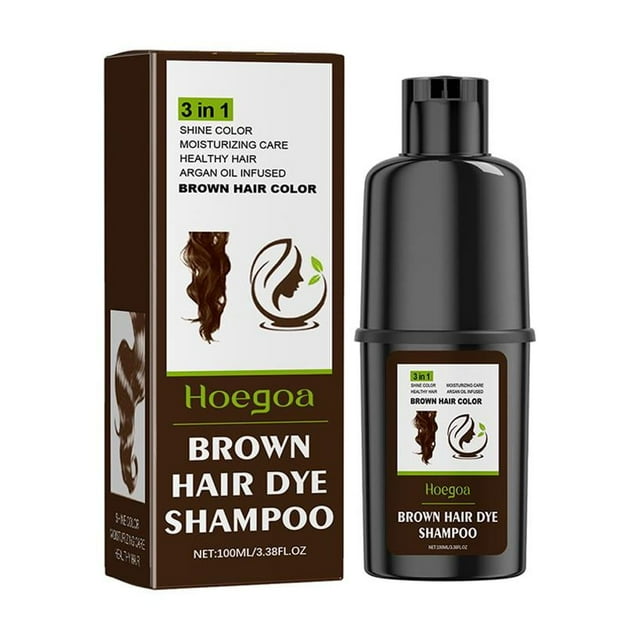 sgacai champú colorante para el cabello plant essence tinte rápido para el cabello 5 minutos esencia natural n — botella cilíndrica marrón de 100 ml junto a su caja frontal; vista centrada con tapa negra y etiqueta que muestra "Brown Hair Dye Shampoo" y un mechón rizado, indica color marrón y tamaño neto; a menudo usado para retoques rápidos entre aplicaciones de tinte.