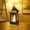 Bronze, variant on Honeeladyy Mini Lanterns LED Small Lanterns Decorative Indoor Outdoor Hanging Lantern Decorative Candle Lanterns Farmhouse Decor for Weddings Western Camping Party Decorations, 3.74*1.65*1.65in
