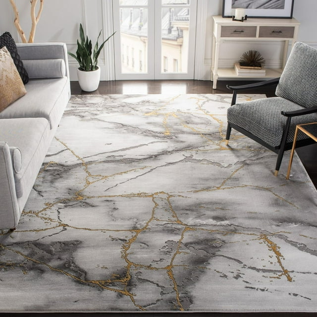 SAFAVIEH Craft Paul Abstract Marble Area Rug featuring gray and gold marble-inspired design in a contemporary living room.
