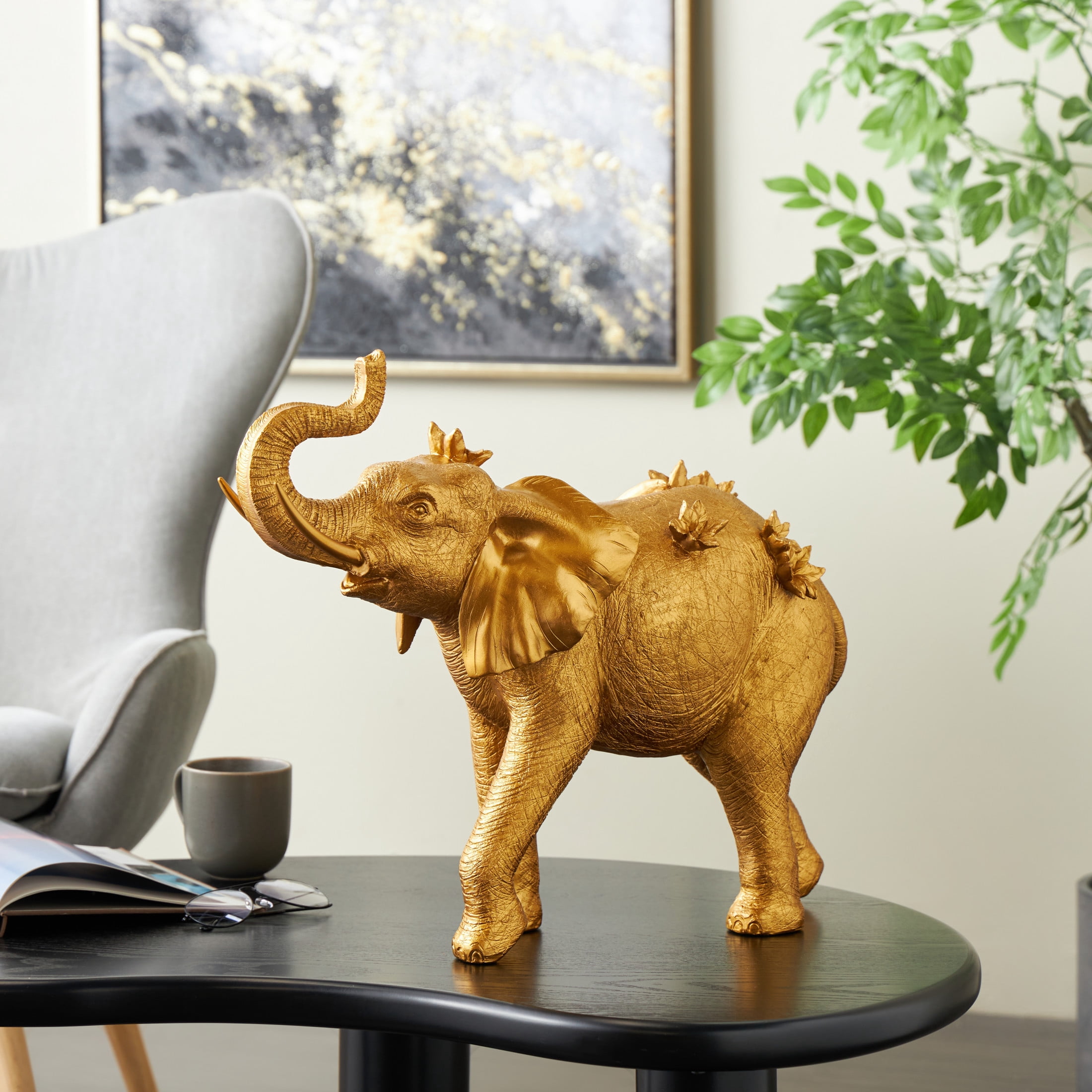 22" x 19" Gold Resin Walking Elephant Sculpture with Floral Accents, by DecMode