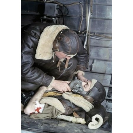 Close-up of a soldier putting an oxygen mask to an injured soldiers face Canvas Art - (18 x 24)