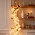 thumbnail image 5 of Traditional Lighted Christmas Wall Decoration with a Gold Leaping Reindeer with a Red Scarf, Cascading LED Hanging Pendant for Hallway and Staircase Wall Decor (Antique Gold), 5 of 5