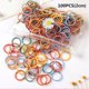 thumbnail image 1 of 100 unids/bolsa encanto niños lindos dulces dibujos animados bandas de goma sólidas niñas encantadoras bandas elásticas para el cabello niños dulces accesorios para el cabello, 1 of 4