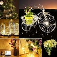 thumbnail image 1 of Cadena de luces a pilas (incluidas), paquete de 20, cable de cobre resistente al agua de 1 m con 10 LED de color blanco cálido para decoración de cumpleaños, fiestas, bodas, veladas, Navidad, jardín,, 1 of 4
