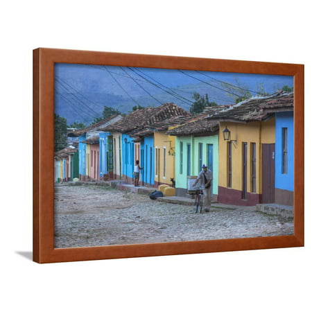 Cuba, Trinidad, a Man Selling Sandwiches Up a Colourful Street in Historical Center Framed Print Wall Art By Jane