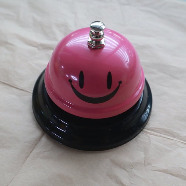 Campana de mano con forma de cara sonriente de metal para entrenamiento de mascotas, barra de servicio para restaurante, campana de convocatoria, contestador automático de competición, mesa de
