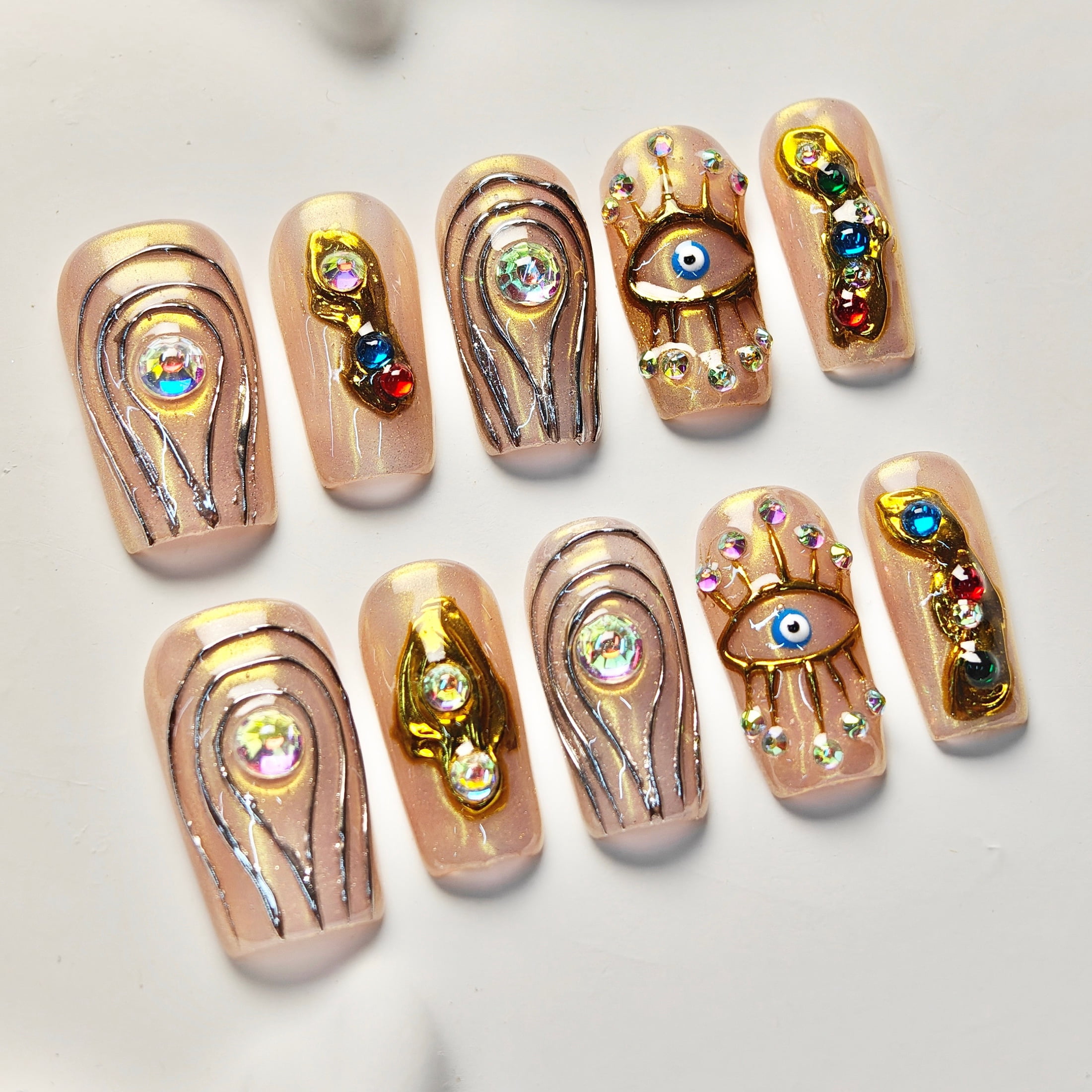 10pcs Stiletto Medium Handmade Y2K Nails - Pink & Nude Base, Hand Drawn Gold Eye & Line Patterns, 3D Rhinestone & Colorful Gems, Summer & Party Nails for Women