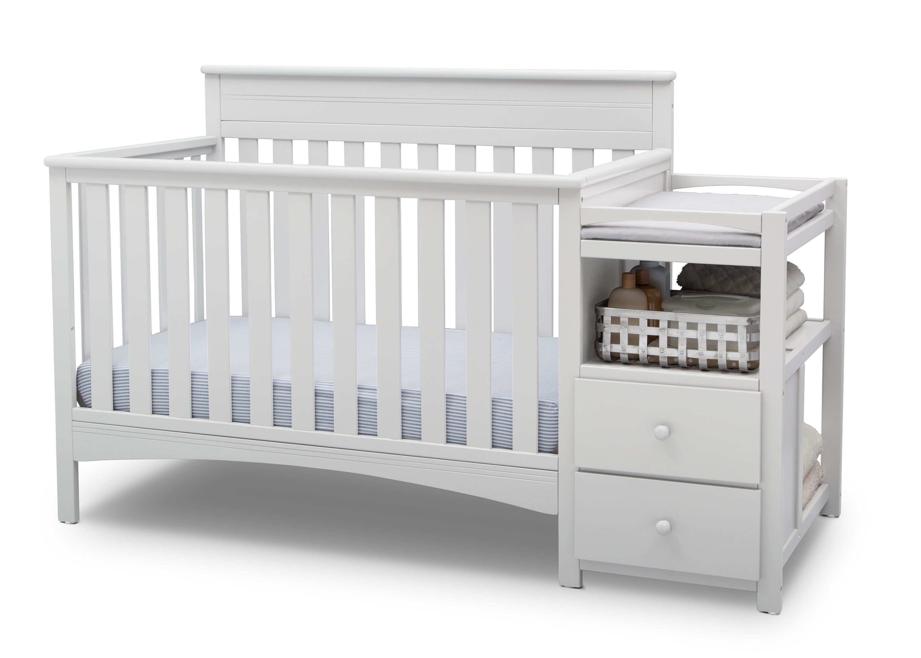 white crib with changing table attached