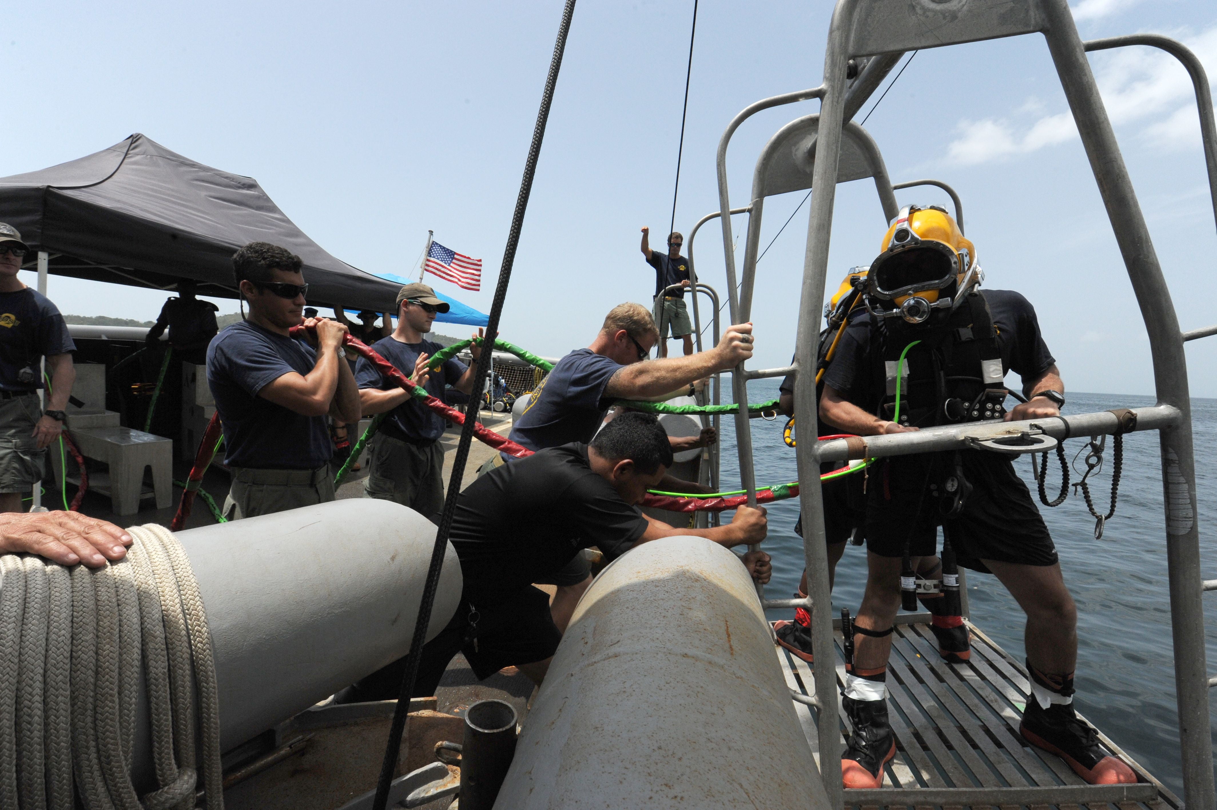 LAMINATED POSTER U.S. Navy divers assigned to Mobile Diving and Salvage
