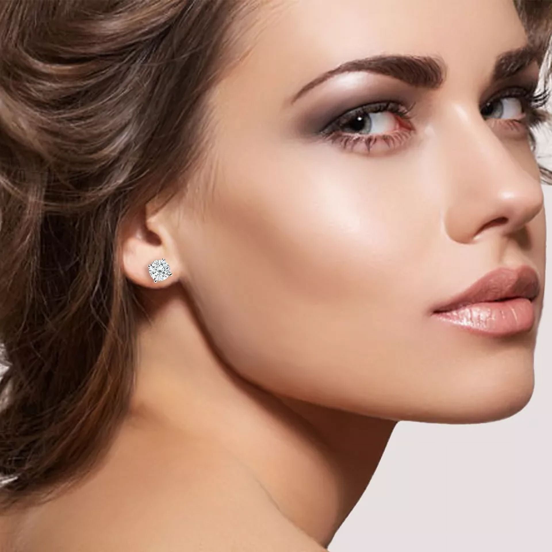 1.0 Ct Round Cut Simulated Diamond Stud Earrings crafted in 14k White Gold over Silver with a screw-back design